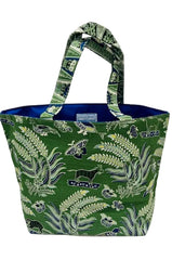 A green fabric tote bag with a botanical and butterfly pattern, featuring a blue interior lining and matching patterned handles, shown against a plain light background.