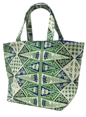 A fabric tote bag featuring a green, blue, and white geometric batik pattern, shown against a plain white background.