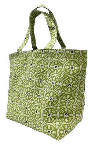 A fabric tote bag with a green, white, and black geometric medallion pattern, featuring two top handles, shown on a plain white background.